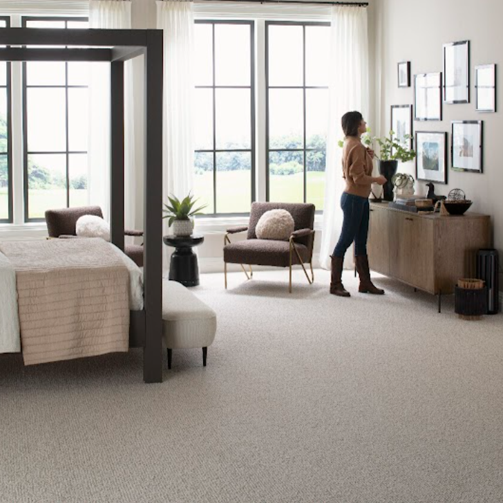 Karastan carpet promotion featuring stylish bedroom with light carpet flooring